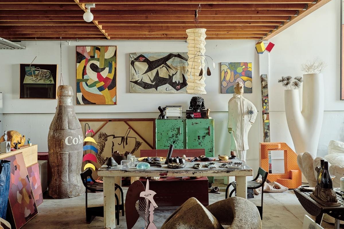 The objects and furniture dealer Jonathan Pessin’s eclectic collection overflows into his Los Angeles home. In the dining area, from left: a 1.8-metre fibreglass Coke bottle; an Alexander Calder-esque multicoloured metal hanging fish sculpture; a painting by the artist and furniture picker Robert Loughlin, drawn with a Sharpie on the back of a vintage painting; an industrial metal cabinet in original green paint with red handles; and a life-size papier-mâché sculpture of Ludwig Mies van der Rohe. An amateur metal sculpture of Darth Vader sits atop the cabinet. Photography by Philip Cheung.