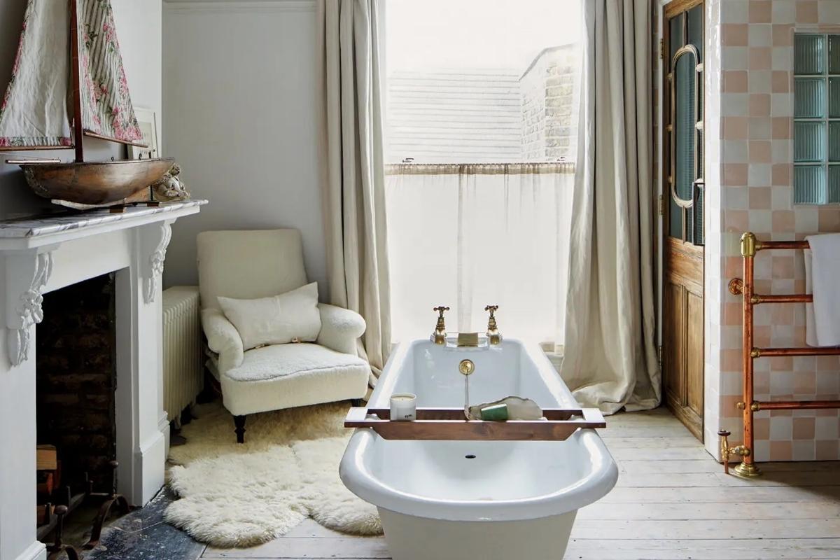 The primary bathroom of Charlotte and Angus Buchanan’s London home features a salvaged turn-of-the-20th-century tub. Photography by David Fernández.