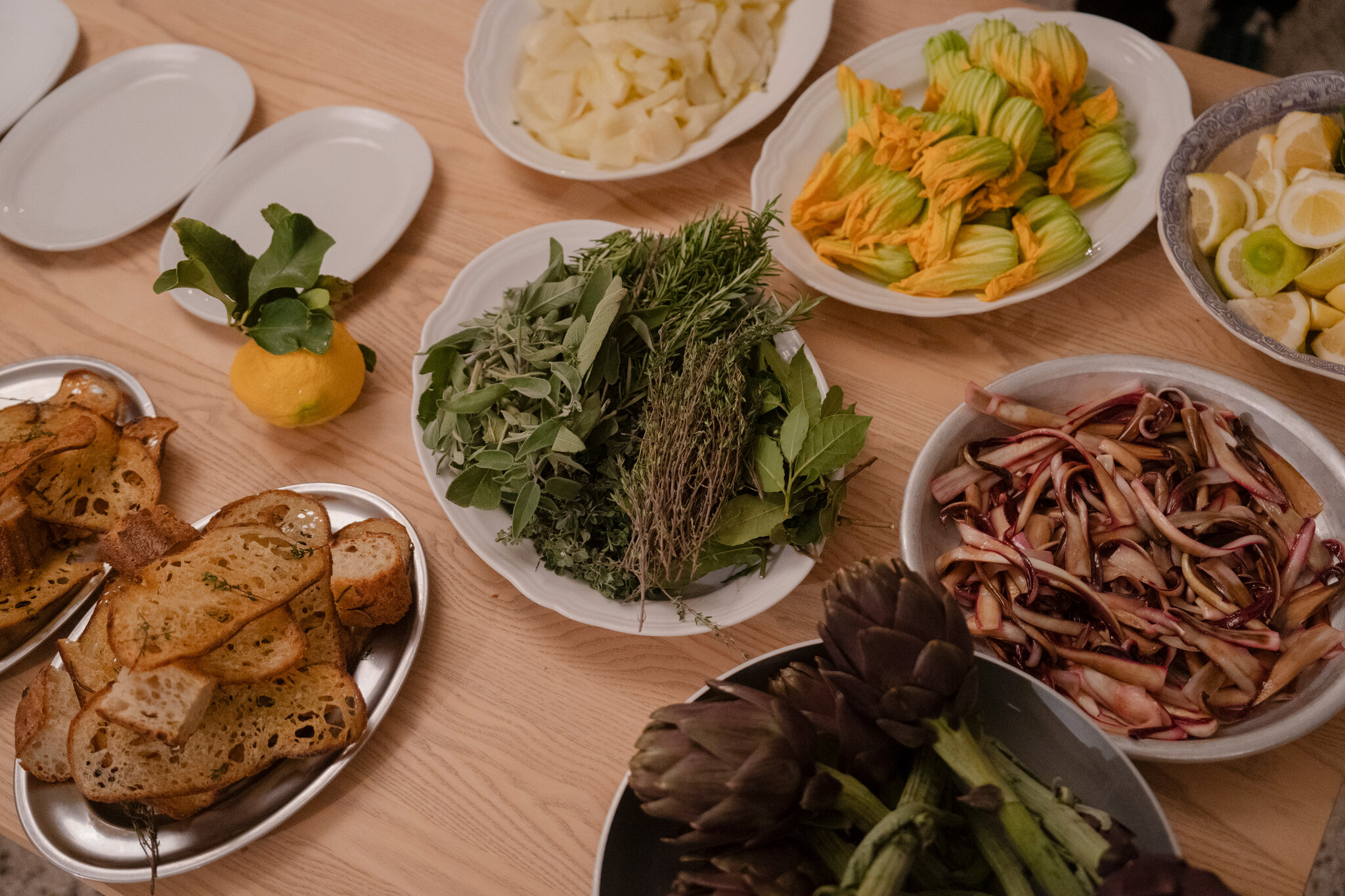 Salads and bread at the table.