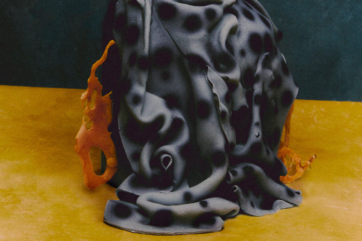 A chocolate, hazelnut and praline cake with polka-dot, draped fondant icing
