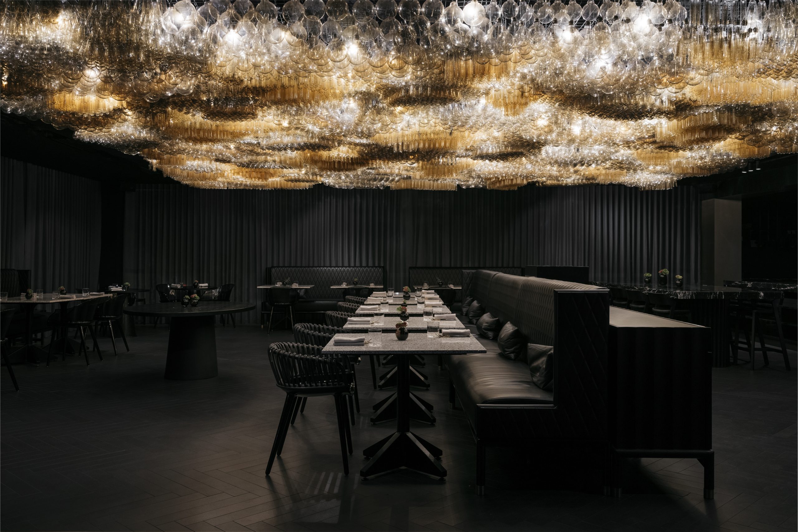 The dining room at Doot Doot Doot, the ceiling covered in 10,000 golden, undulating lights installed by artist Jan Flook.