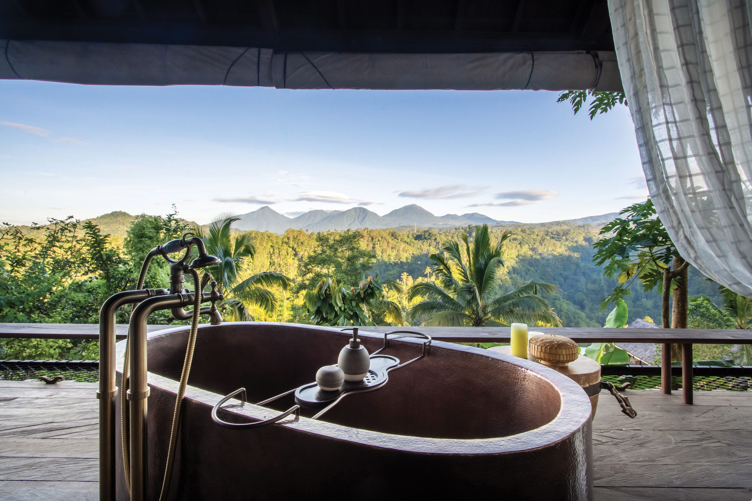06-Bathtub Buahan’s private eco-villas feature open-air hand-beaten copper bathtubs.