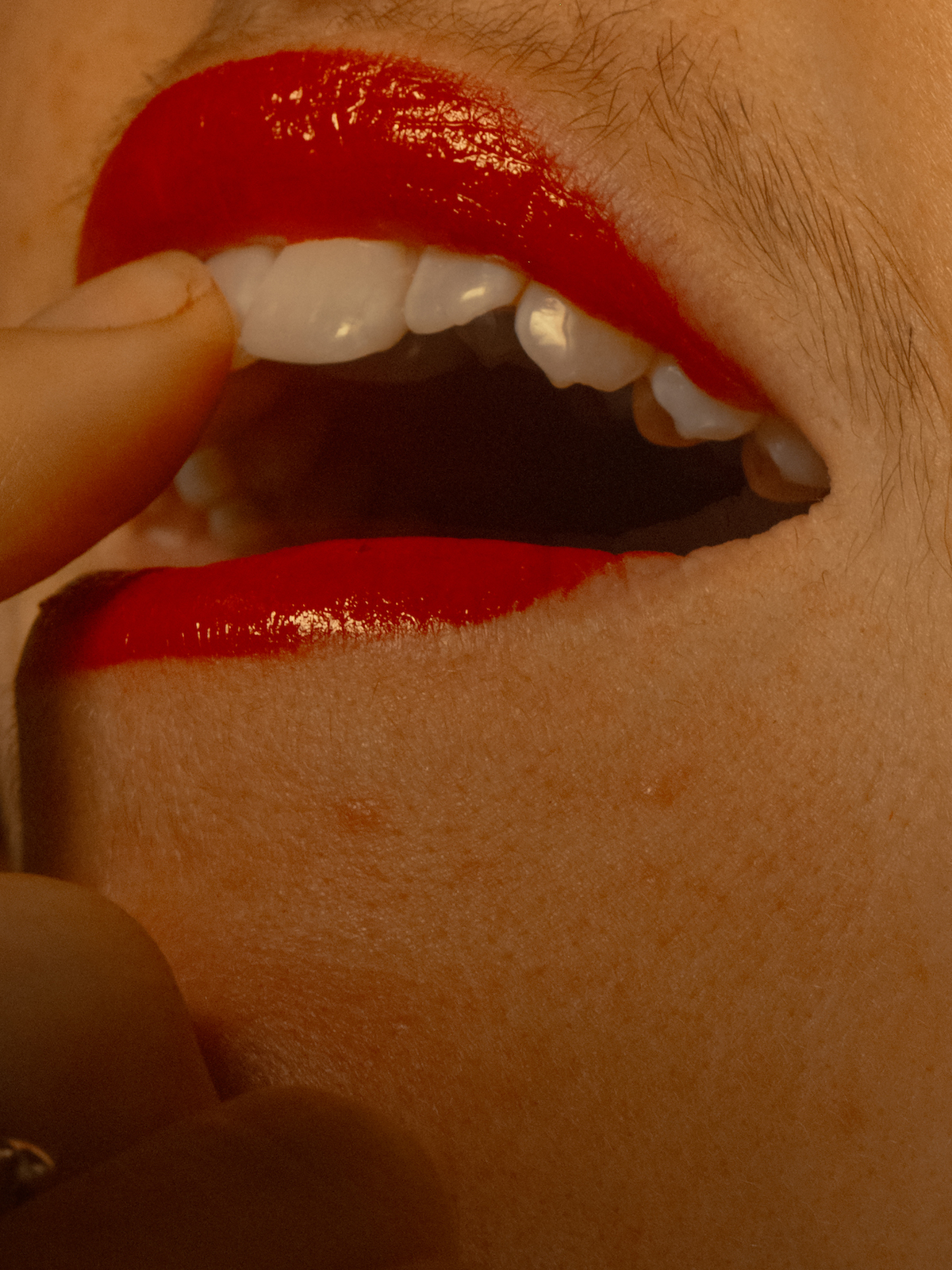 A person with facial hair applies lipstick in Italy in November 2024. (Lisa Sorgini/The New York Times) A person with facial hair applies lipstick in Italy in November 2024. (Lisa Sorgini/The New York Times)